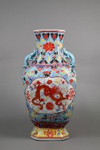 A large Chinese baluster vase with applied moulded chilong dragon handles, the front and back with a