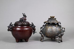A Japanese tripod incense burner (koro) and pierced cover with guardian lion finial and handles,