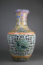 A Chinese yangcai double walled vase, the lotus scroll blue and white cylindrical inner vase