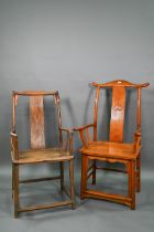 An antique Chinese elm open armchair with panelled seat and shaped vertical splat to/w a 20th