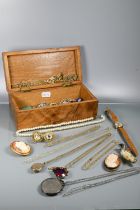 A collection of vintage jewellery in cigar box including yellow metal oval locket, simulated pearl
