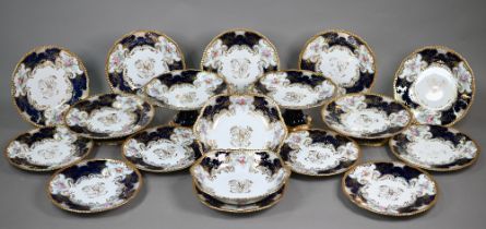 A Limoges dessert service with HAC gilt monogram within border of painted and printed floral