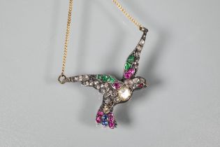 A multigem-set pendant in the form of a dove with outstretched wings adorned with mixed cut