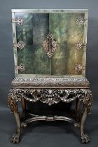 A good Art Deco period ivory banded shagreen cocktail cabinet, with ornate engraved silver plated