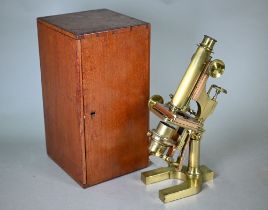 A vintage lacquered brass microscope by W Watson & Sons, High Holborn, no 3419, in teak case