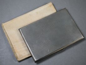 A heavy quality engine-turned cigarette case, W.H. Manton Ltd, Birmingham 1957, 6oz, c/w chamois-