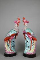 A pair of 19th century Chinese export porcelain famille rose phoenix figures, well modelled standing