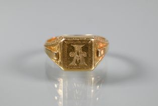 An 18ct yellow gold signet ring with carved shoulders and monogrammed 'A' to face, size Y, approx