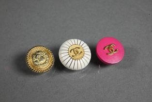 Chanel - Three sets of buttons - eight gilt metal, nine pink with 'CC' motif and twelve white, all