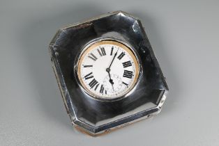 A Goliath travel watch, the white enamelled dial with Roman numerals and subsidiary seconds, in a