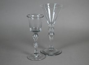 A drinking glass with flared bucket bowl on hollow double knop baluster stem and folded foot, 16.7