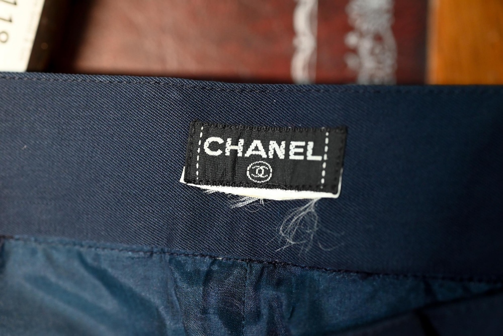 Chanel - A pair of navy trousers, with pleated front and gilt metal button detailing, fully lined, - Image 6 of 6