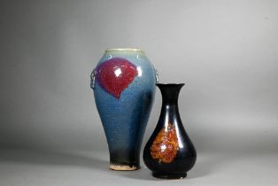 A Chinese Junyao baluster vase with moulded taotie mask handles, opaque blue glaze with large