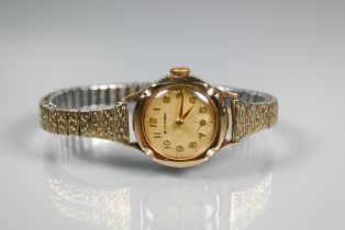 A lady's Richmond brand cocktail wristwatch, 9ct gold cased with champagne dial and subsidiary