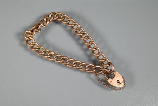 A 9ct rose gold curb bracelet with padlock and safety chain attached, approx 9.1g