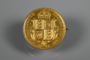 A Queen Victoria gold half sovereign, dated 1887, fitted as a brooch