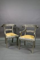 A pair of Indian metal clad dining hall chairs, with rams head back terminals over sabre front