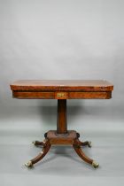 A Regency brass inlaid rosewood card table, the fold over top with baize lined interior, raised on a