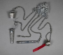 A late Victorian engraved and pierced silver chatelaine with five chains with dog-clips, Lawrence