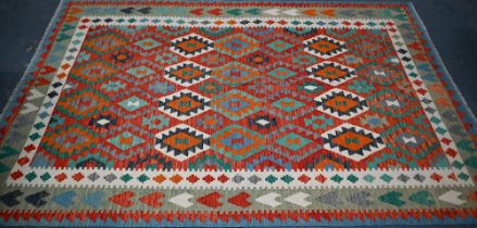 A contemporary Anatolian kelim, the geometric design executed in multi-colours, 297 cm x 208 cm