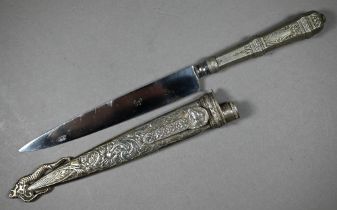 A Gaucho boot-knife with 15 cm stainless steel blade on engraved white metal hilt and foliate-chased