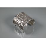 Patrick Mavros - A silver 'Croc Hornback' cuff, size small (approx 5.5cm diam on largest edge),