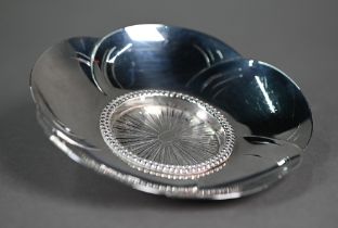 A Japanese white metal lotus-flower dish, the center engraved with a stylised peacock design,