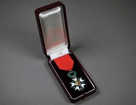 A French order of The Legion d'Honneur (Chevallier) Knights breast badge in silver and enamels, on