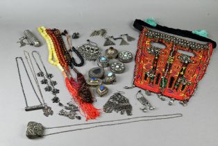 Four bead necklaces including one yellow amber, a Yemeni needle worked face veil with applied