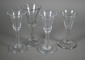 A Georgian drinking glass with bell bowl, with bubble to base, plain stem and domed foot with folded