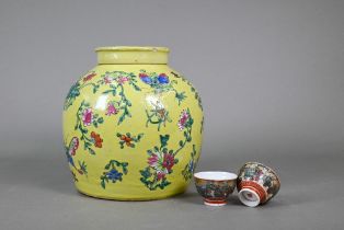 A 19th century Chinese famille rose ginger jar and cover with lime-green glaze and decorated with