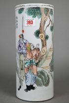 An early 20th century Chinese cylindrical hat stand painted in polychrome enamels with a landscape