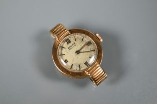 An 18K gold ladies Rolex wristwatch, with 18 jewel movement and champagne dial, 21 mm dia., 12 g