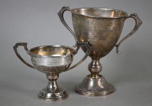 Two silver two-handled trophy cups on stemmed foot, William Neale & Son Ltd/TS (not identified),