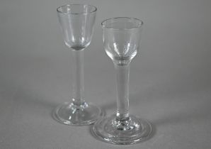 An 18th Century cordial glass with ogee bowl on plain stem and folded foot, 14cm, to/w a somewhat