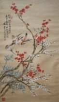 A 20th century Chinese watercolour on fabric painting of birds and prunus with calligraphy