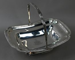 A George III silver fruit basket with reeded swing handle, gadrooned rims and raised foot,