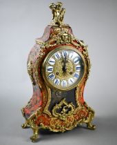 An Art Nouveau brass mounted and inlaid tortoiseshell mantel clock, the two train 8-day movement