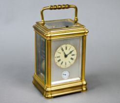 A 19th century French brass carriage alarm clock, the two train 8-day grande sonnerie and petite