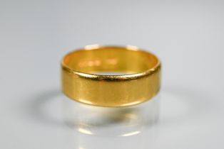 A 22ct yellow gold wide wedding band, size U, approx 6.3g