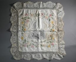 A World War I North France souvenir silk shawl, with crochet edging and applied roses and