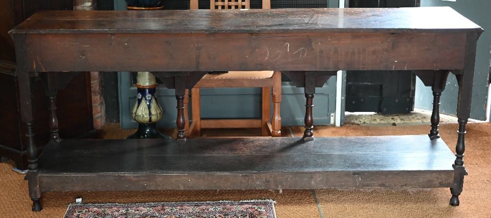 An antique oak low dresser with three double moulded front drawers over a triple arched apron, - Image 19 of 23