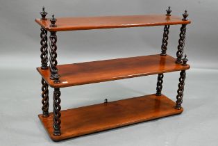 A Regency style graduated three tier wall shelf with open spiral supports, 81 x 26 x 57 cm high