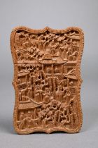 A late 19th century Chinese Canton sandalwood card case, late Qing dynasty, profusely carved with