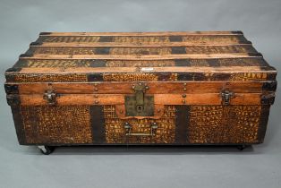 A vintage steel and wood bound crocodile skin panelled trunk, with leather carrying handles, 92 cm w