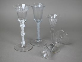 A cordial glass with foliate-etched bell bowl and triple-knop opaque twist stem, 17.5 cm, to/w