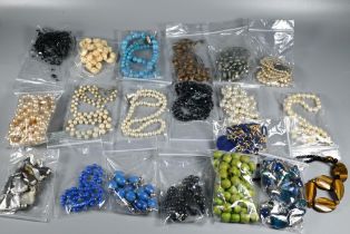 A large collection of bead necklaces including pearls, tiger's eye, glass etc