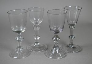 A cordial glass with ogee bowl, double-knop baluster stem and conical folded foot and another