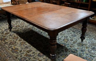 An early Victorian mahogany draw leaf dining table, with single insert leaf, the top with moulded