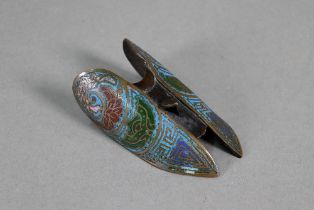 An antique Chinese bronze and cloisonne armour component, possibly a finger guard, polychrome